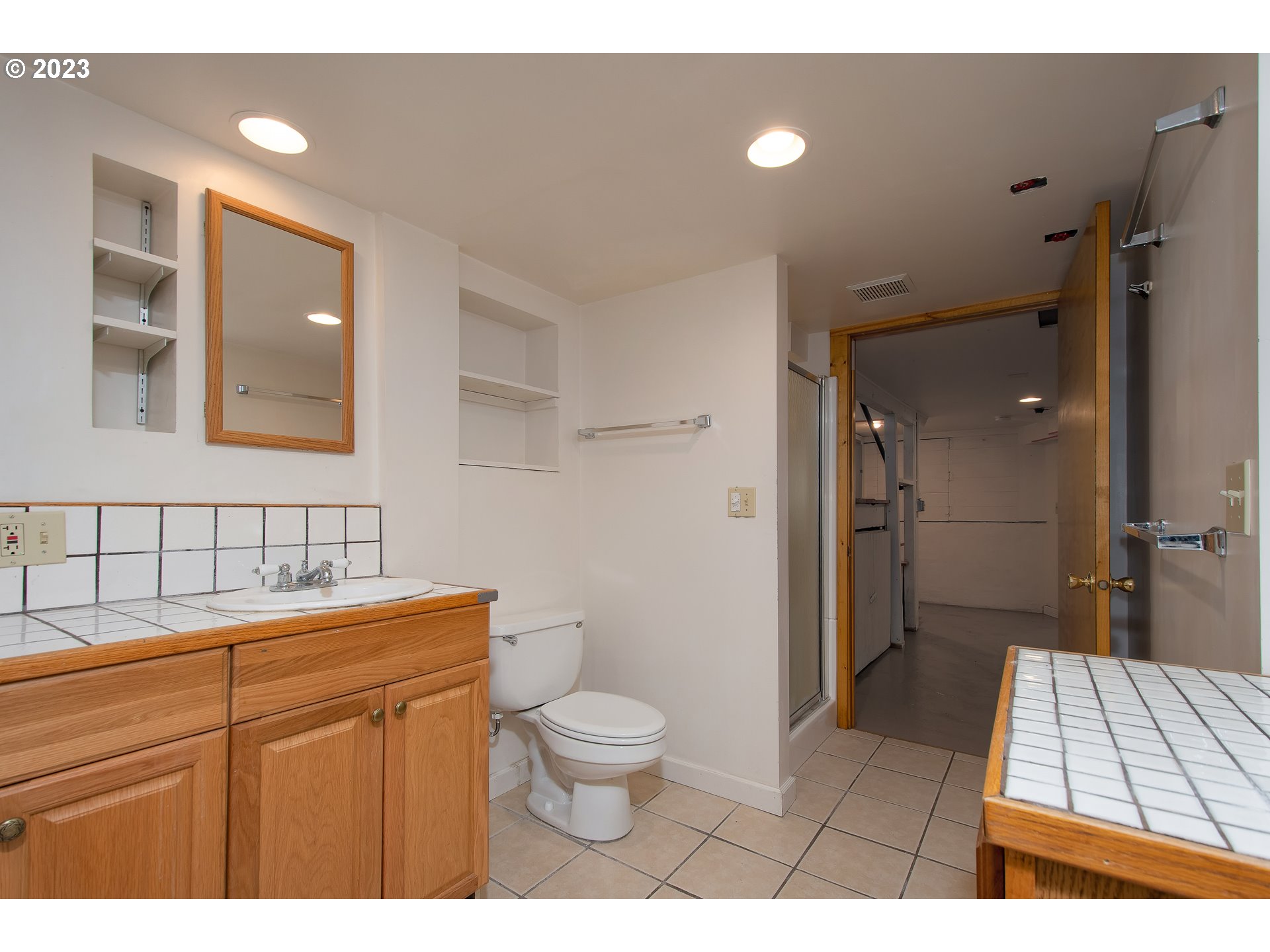 3519 Southeast Morrison Street Portland, OR 97214 - Photo 31 of 43 a bathroom with a toilet a sink and mirror
