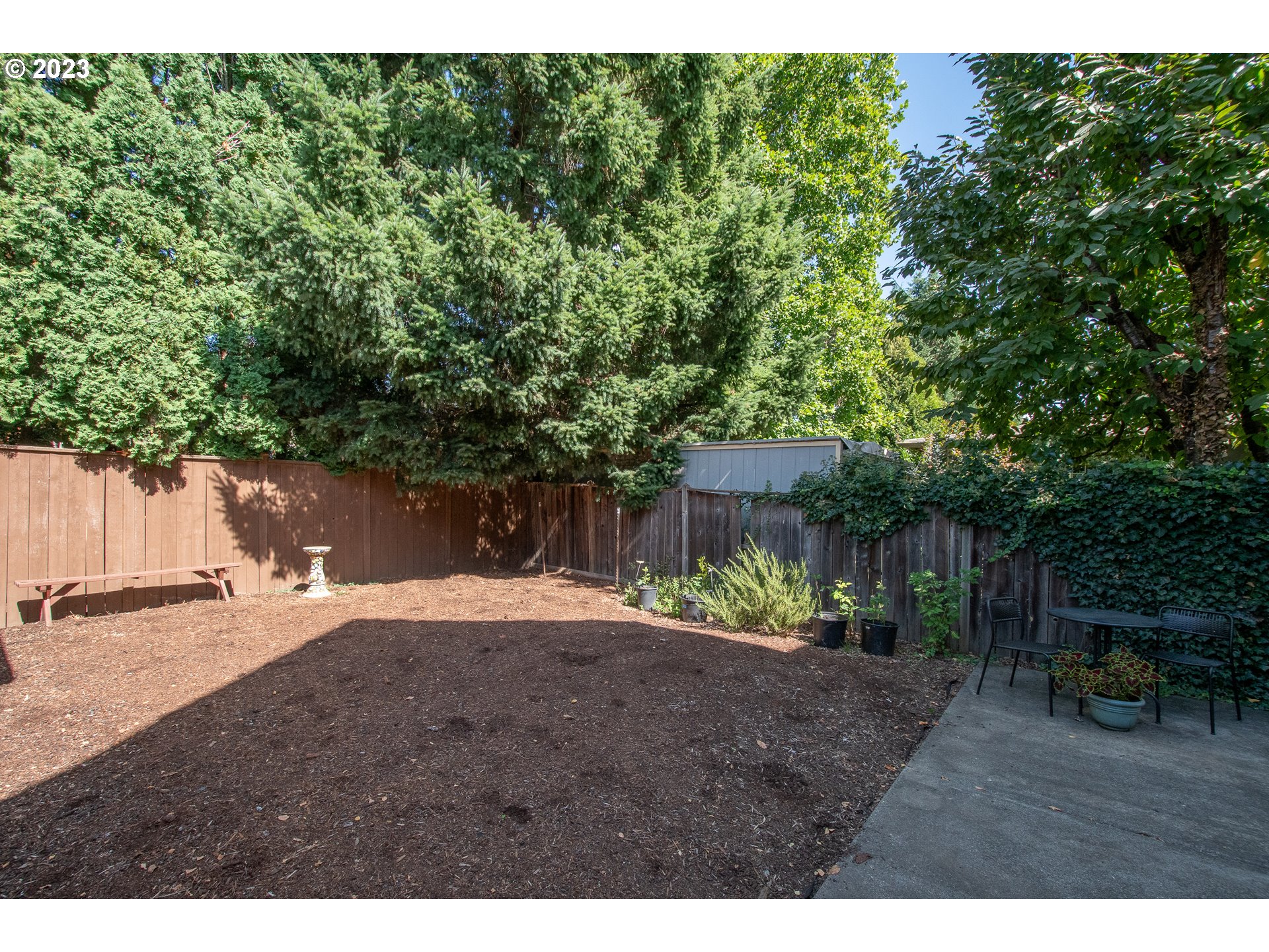 3519 Southeast Morrison Street Portland, OR 97214 - Photo 33 of 43 a backyard of a house with table and chairs