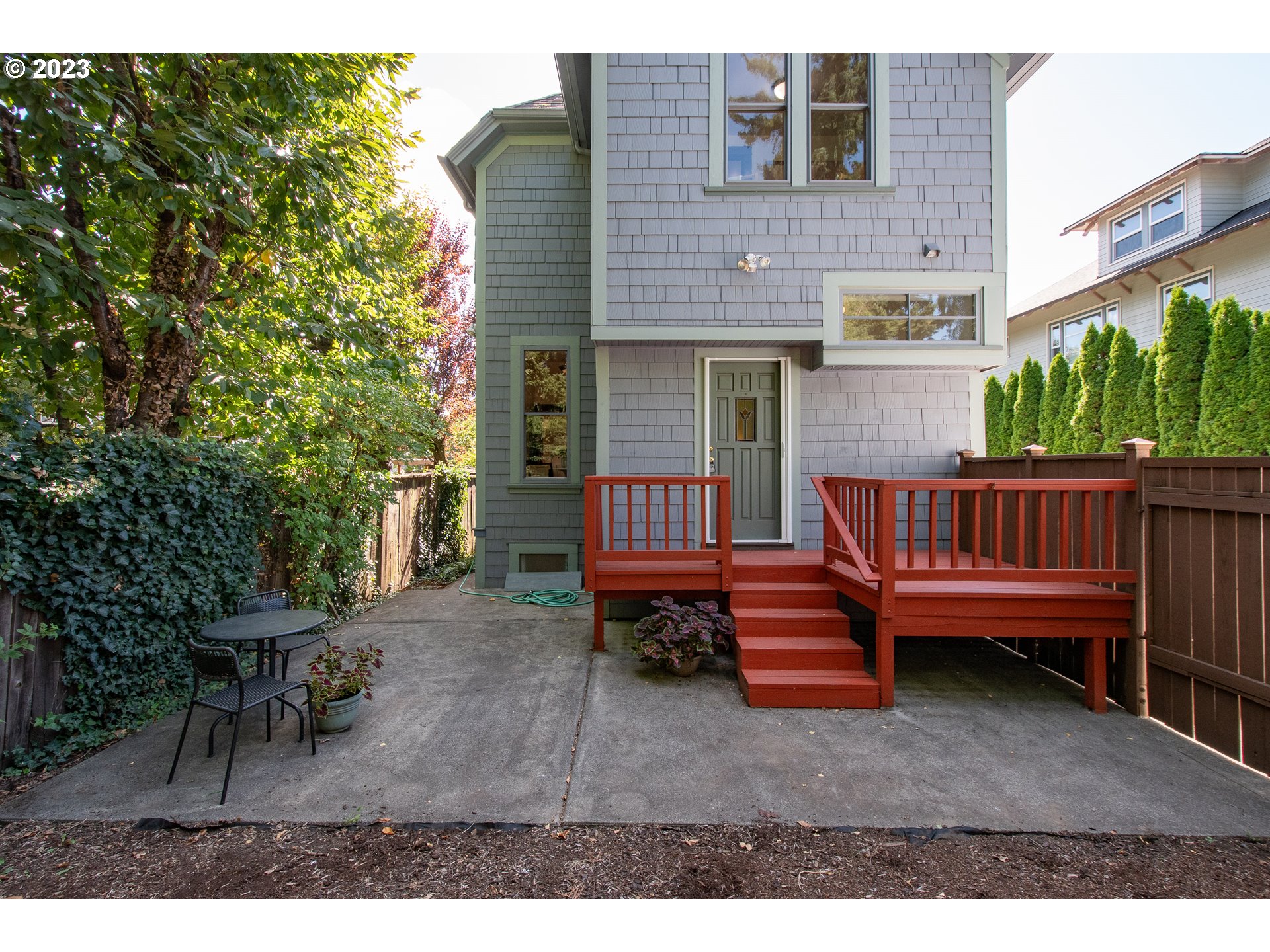 3519 Southeast Morrison Street Portland, OR 97214 - Photo 35 of 43 a backyard of a house with barbeque oven table and chairs