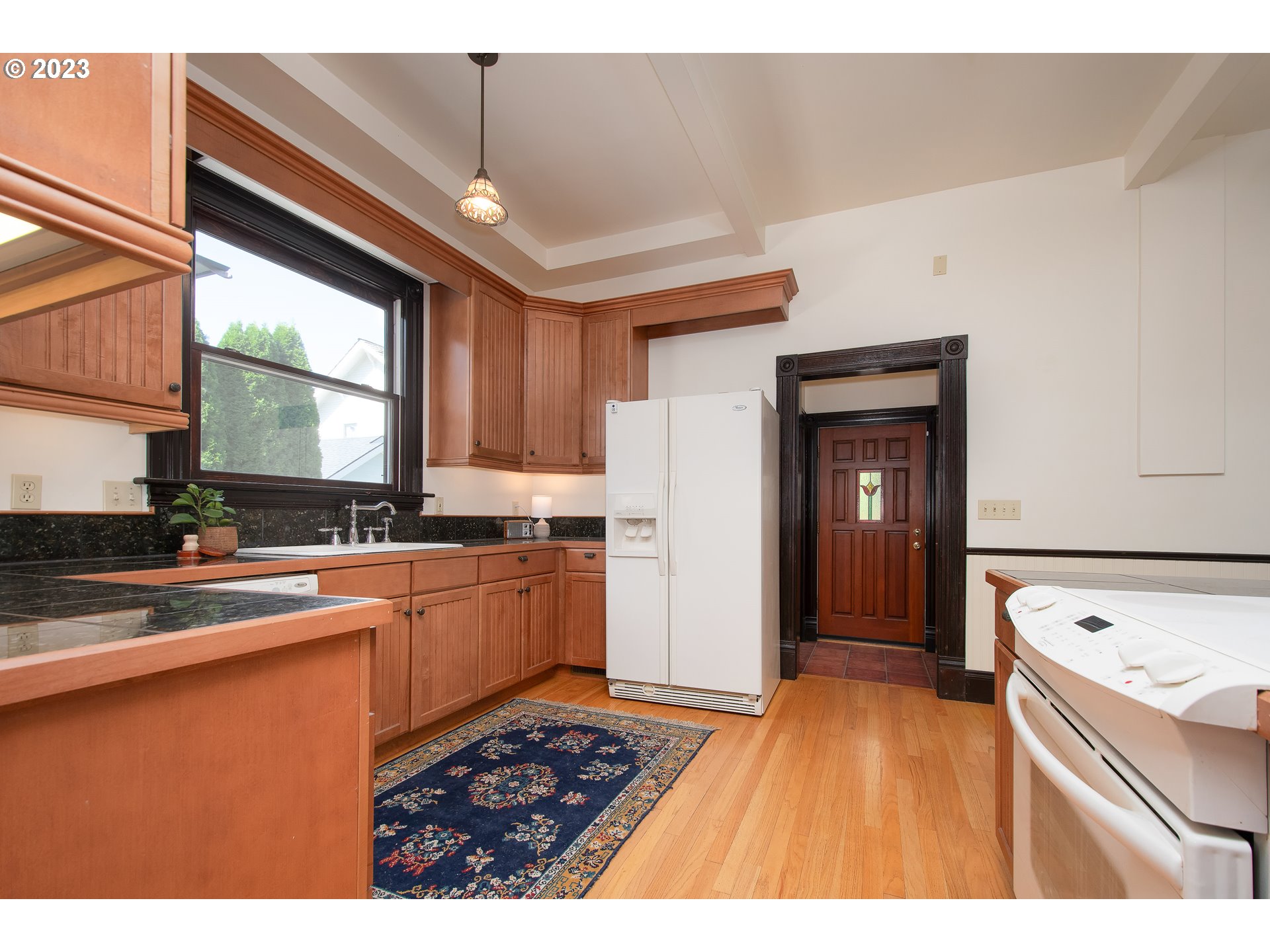 3519 Southeast Morrison Street Portland, OR 97214 - Photo 9 of 43 a kitchen with a sink stove and cabinets