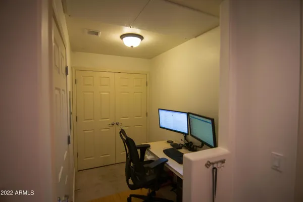 a workspace with furniture and lamp