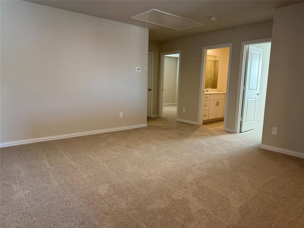 1736 Arches Road Anna, TX 75409 - Photo 12 of 18 Unfurnished bedroom featuring light carpet and ensuite bathroom