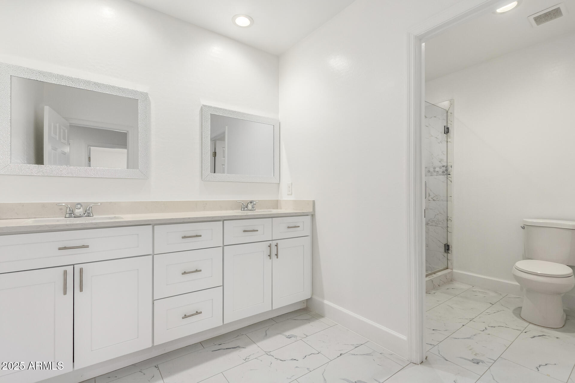 15640 North Verde Street Surprise, AZ 85378 - Photo 21 of 56 a bathroom with a granite countertop toilet sink and mirror
