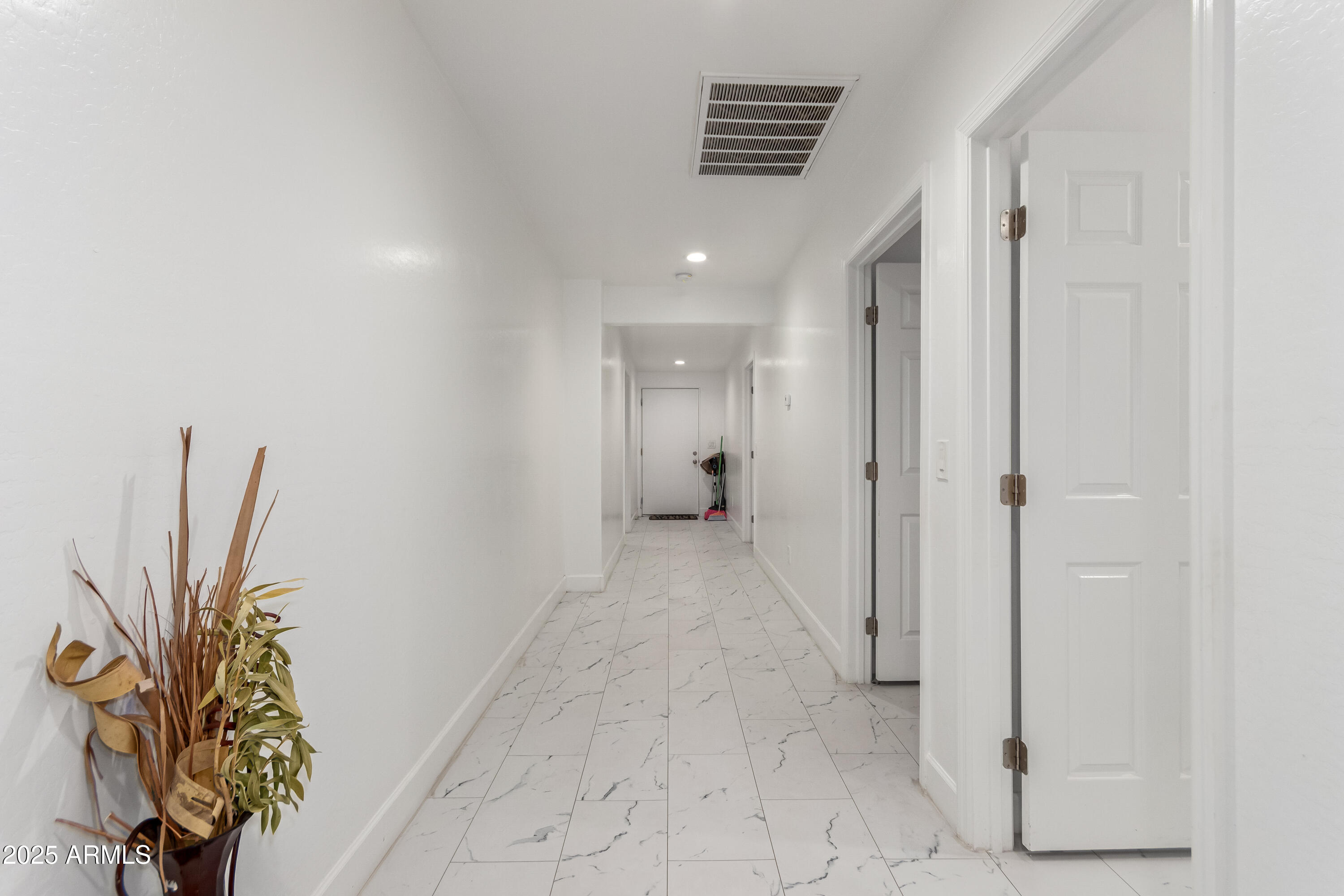 15640 North Verde Street Surprise, AZ 85378 - Photo 3 of 56 a view of entryway with wooden floor