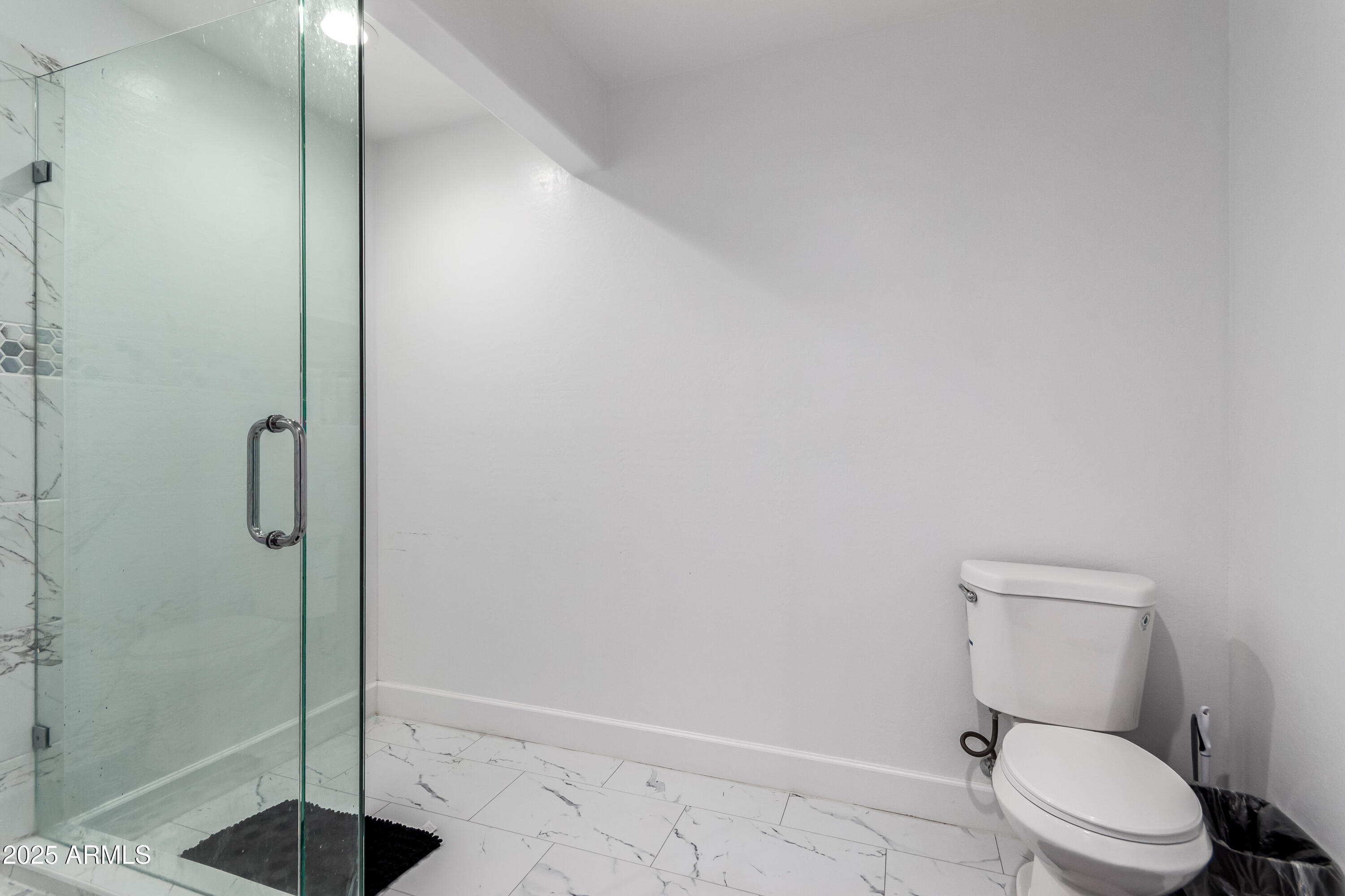 15640 North Verde Street Surprise, AZ 85378 - Photo 43 of 56 a bathroom with a toilet and a shower