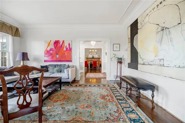 a view of a dining room with furniture and a window