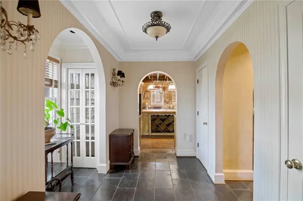 a room with stainless steel appliances kitchen island granite countertop furniture and a kitchen view