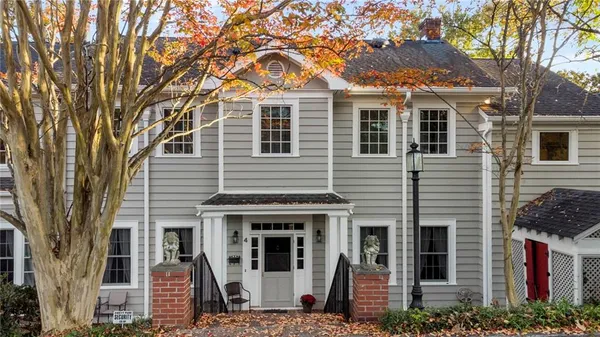 a view of a patio with table and chairs and potted plants