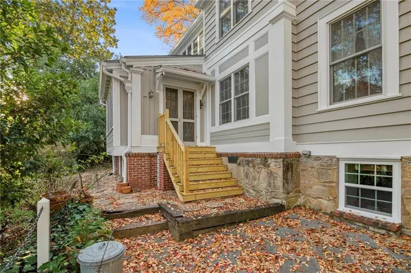 a view of a livingroom with furniture and hardwood floor