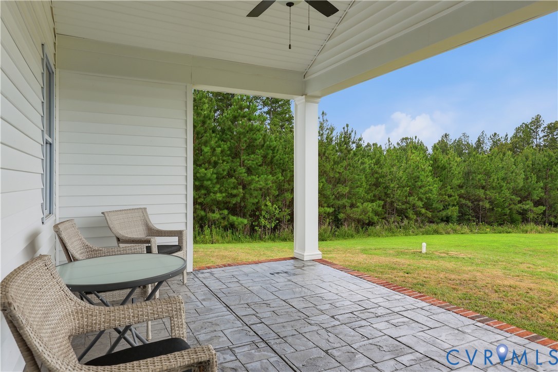 25181 West Soap Stone Road Jetersville, VA 23083 - Photo 17 of 54 Covered patio featuring stamped concrete flooring,