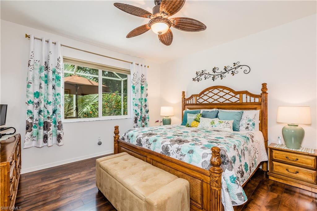 14151 Fall Creek Court Naples, FL 34114 - Photo 13 of 35 a bedroom with a bed and a window