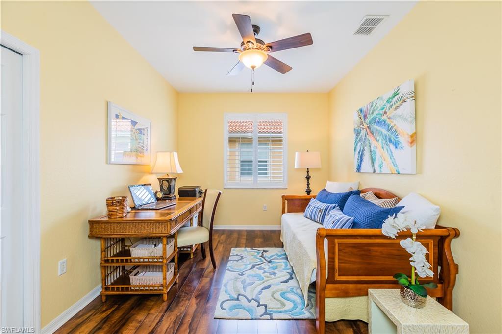 14151 Fall Creek Court Naples, FL 34114 - Photo 17 of 35 a living room with furniture and a chandelier