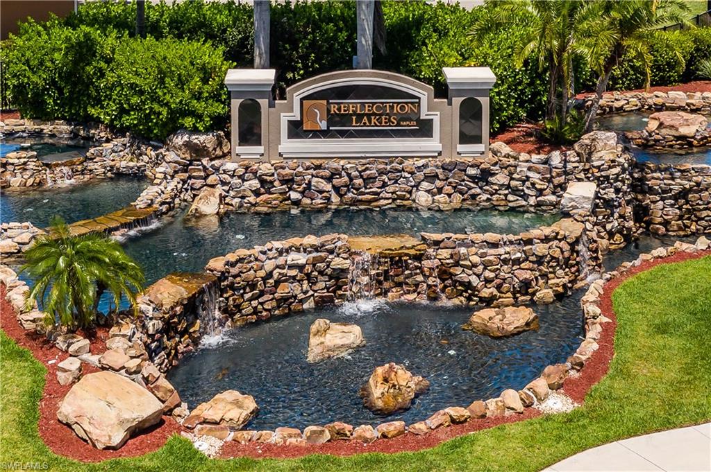 14151 Fall Creek Court Naples, FL 34114 - Photo 20 of 35 a view of a house with yard and sitting area