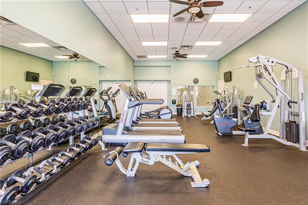 14151 Fall Creek Court Naples, FL 34114 - Photo 28 of 35 a view of a room with gym equipment