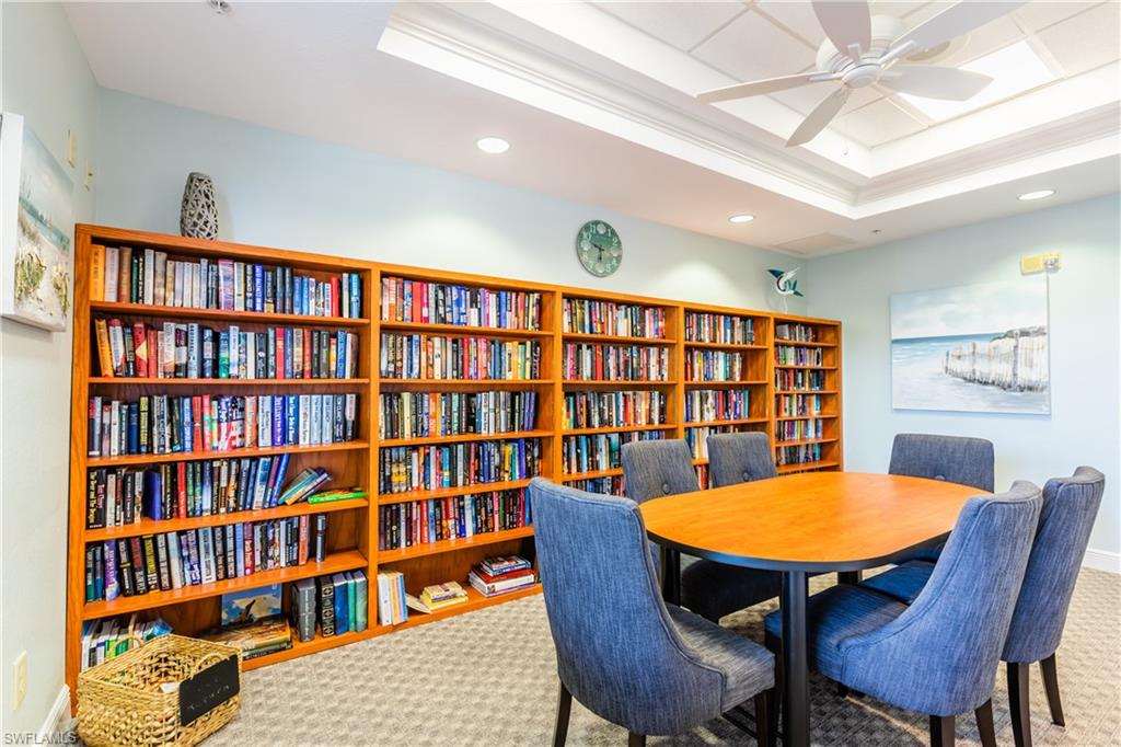 14151 Fall Creek Court Naples, FL 34114 - Photo 29 of 35 a view of a room with furniture and wooden floor