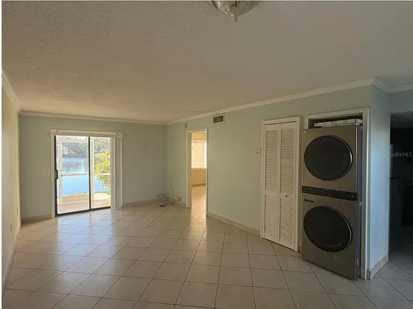 a view of a hallway with washer and dryer