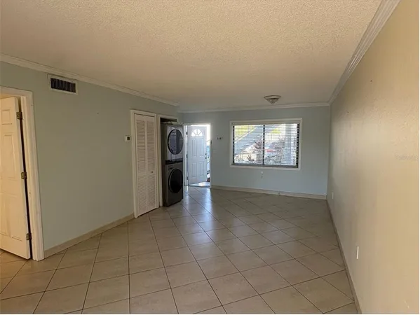 a view of an empty room and window in a house