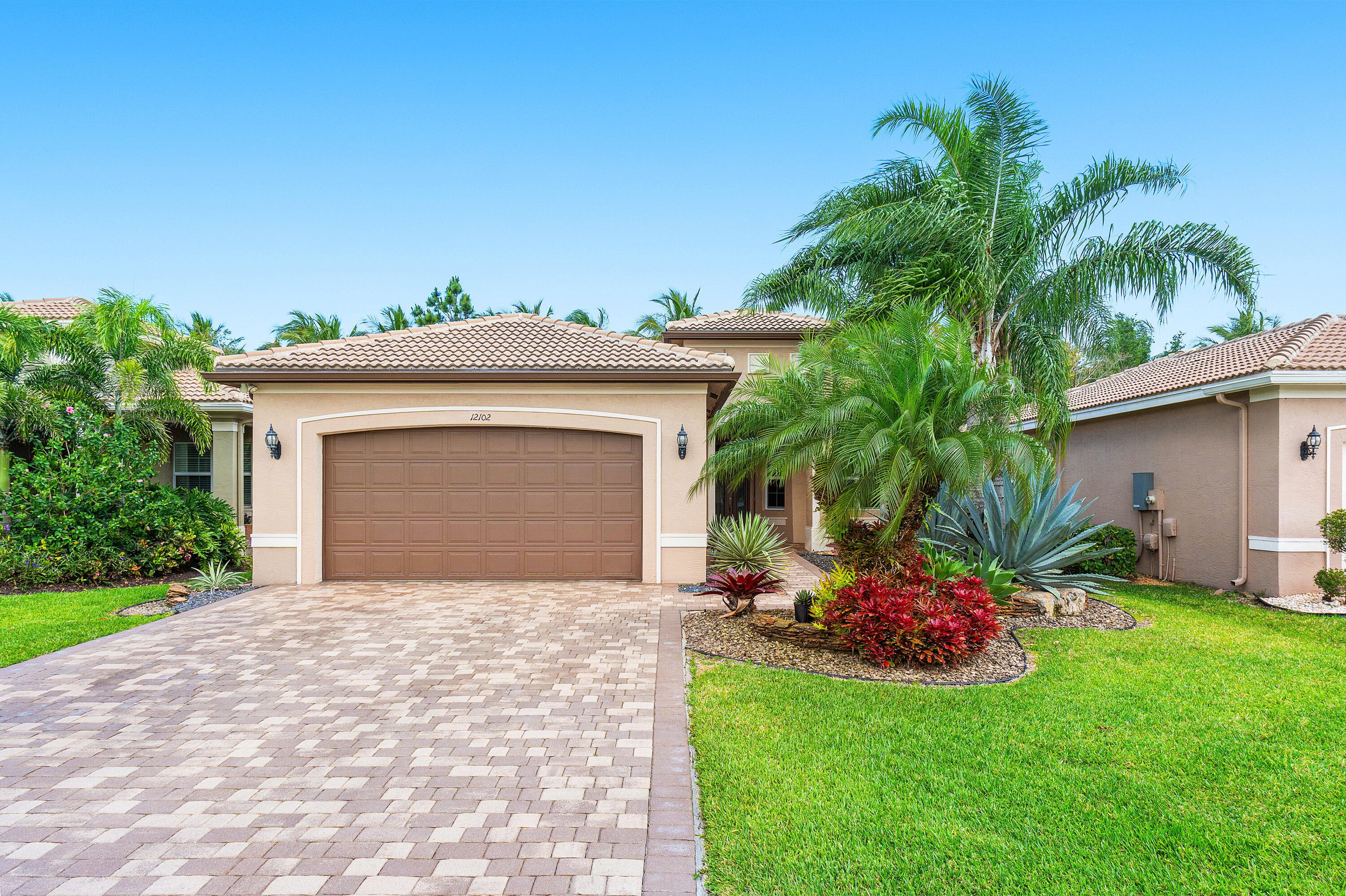 12102 Neptune Peak Drive Boynton Beach, FL 33473 - Photo 2 of 70 Lushly Landscaped Exerior