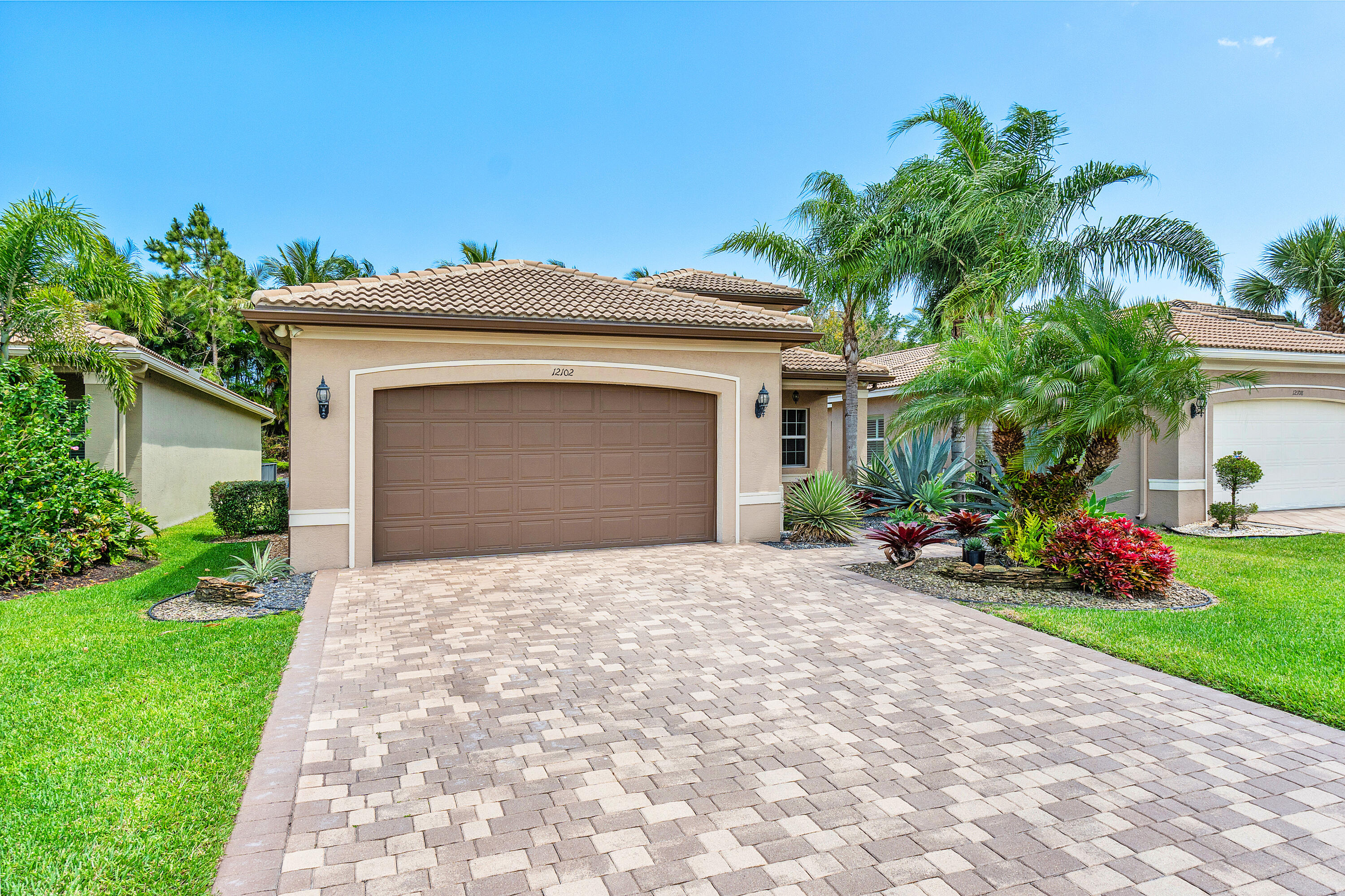 12102 Neptune Peak Drive Boynton Beach, FL 33473 - Photo 3 of 70 Lushly Landscaped Exerior