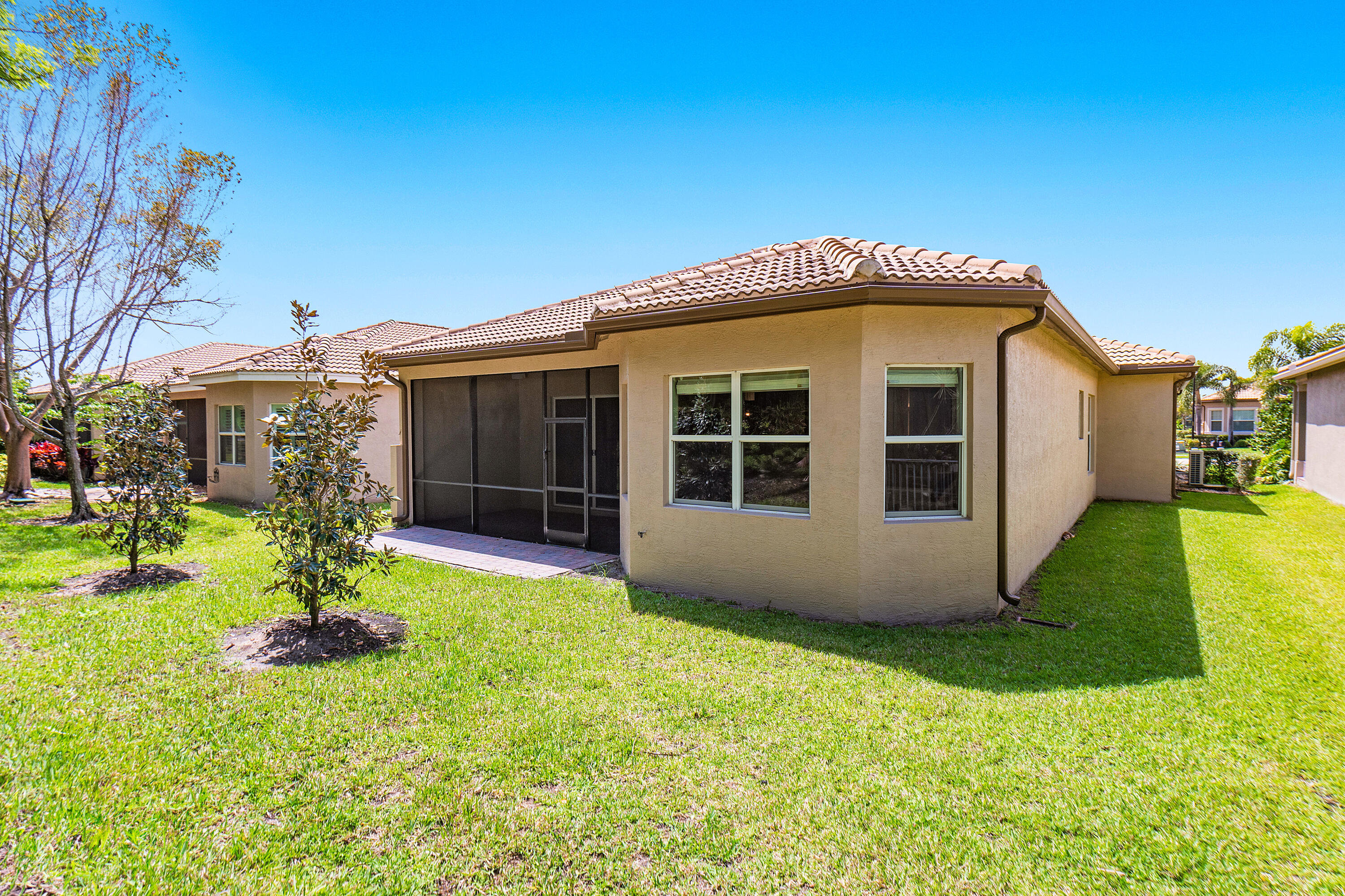 12102 Neptune Peak Drive Boynton Beach, FL 33473 - Photo 31 of 70 Exterior Rear Of Home and Rear Yard