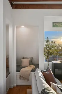 a bed room with a bed and a chair