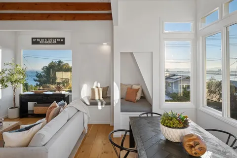 a view of a house with a yard and sitting area