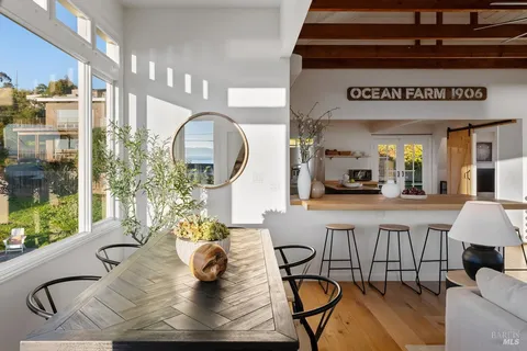 a front view of a house with a yard table and chairs