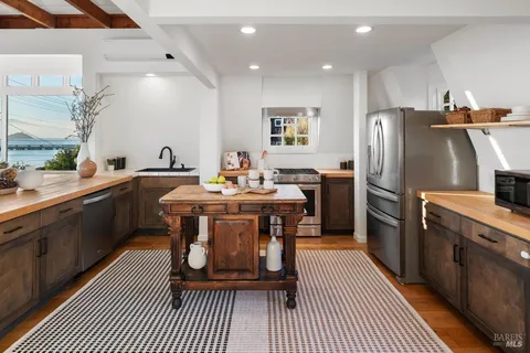 an aerial view of a city with lots of residential buildings lake and ocean view