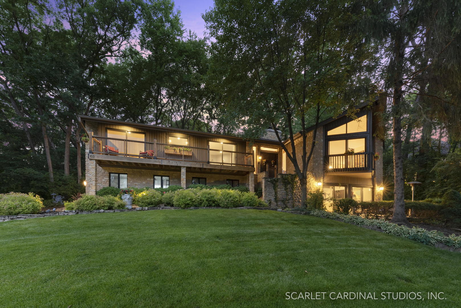 a front view of house with yard and green space