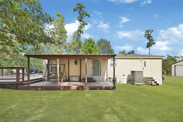 a view of a house with backyard porch and patio