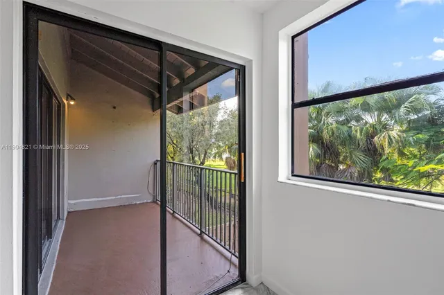 a view of a glass door with a outdoor space