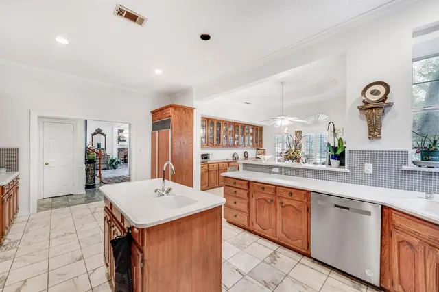 a dining room with furniture a chandelier and window