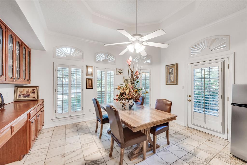 7204 Debbe Drive Dallas, TX 75252 - Photo 17 of 40 a dining room with furniture a chandelier and window