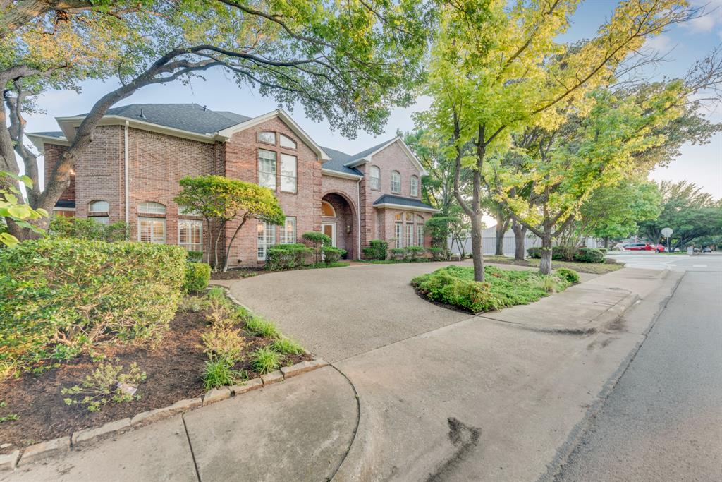7204 Debbe Drive Dallas, TX 75252 - Photo 2 of 40 a front view of a house with garden