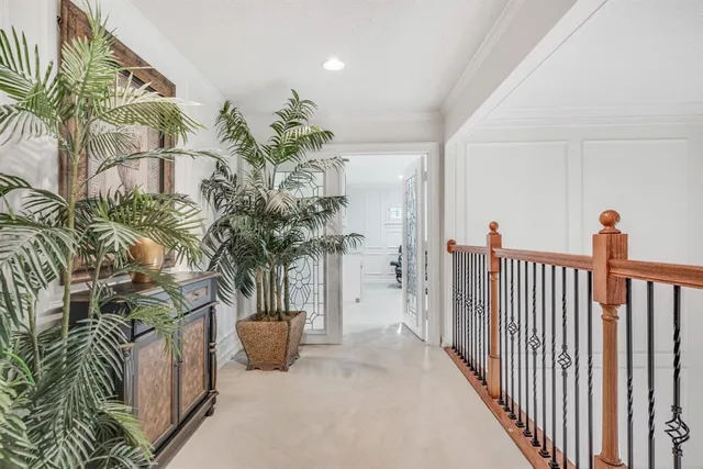 a spacious bedroom with a bed a table and chair