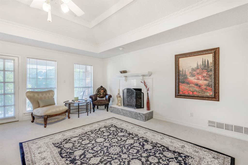 7204 Debbe Drive Dallas, TX 75252 - Photo 26 of 40 a living room with furniture and a rug