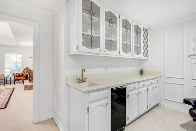 a balcony with furniture and next to a window