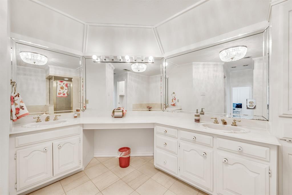 7204 Debbe Drive Dallas, TX 75252 - Photo 33 of 40 a spacious bathroom with a double vanity sink mirror and