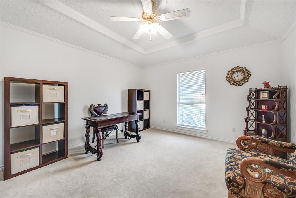 7204 Debbe Drive Dallas, TX 75252 - Photo 34 of 40 a view of a livingroom with furniture and a fan