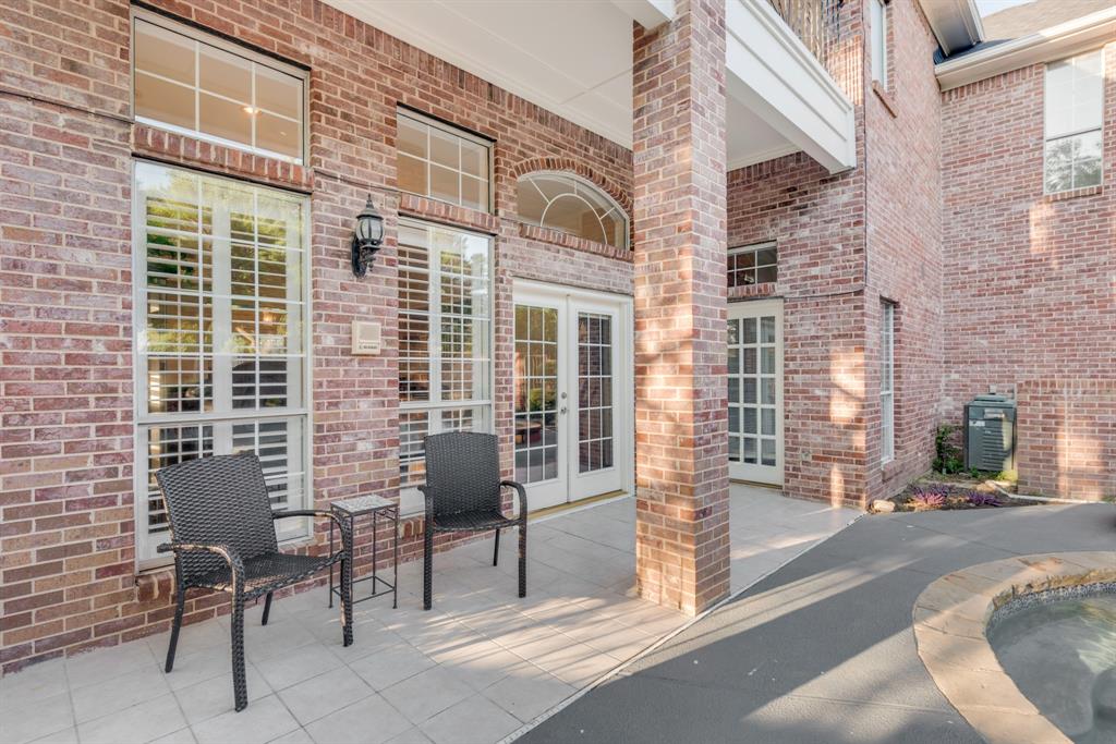 7204 Debbe Drive Dallas, TX 75252 - Photo 37 of 40 a view of a brick building with a outdoor space