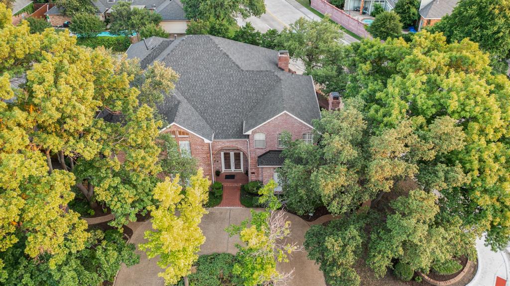 7204 Debbe Drive Dallas, TX 75252 - Photo 4 of 40 an aerial view of a house with swimming pool and garden