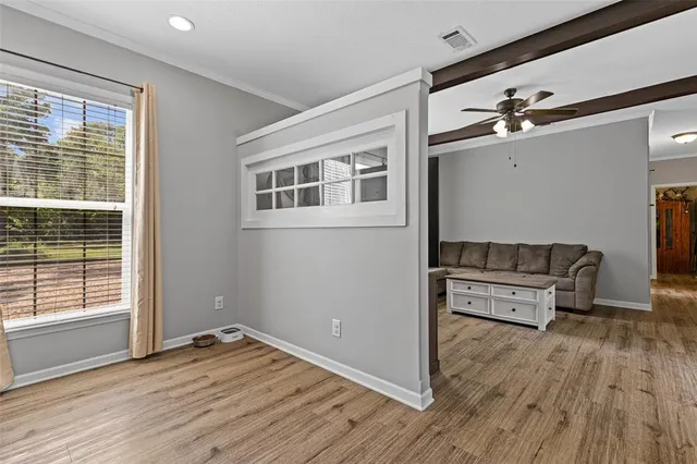 a view of a livingroom with furniture and wooden floor