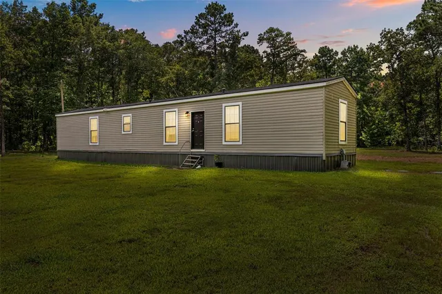 a front view of house with garden