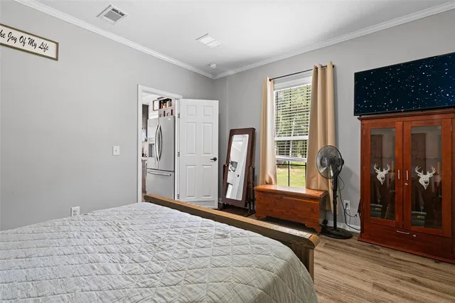 a bed room with a bed and a window