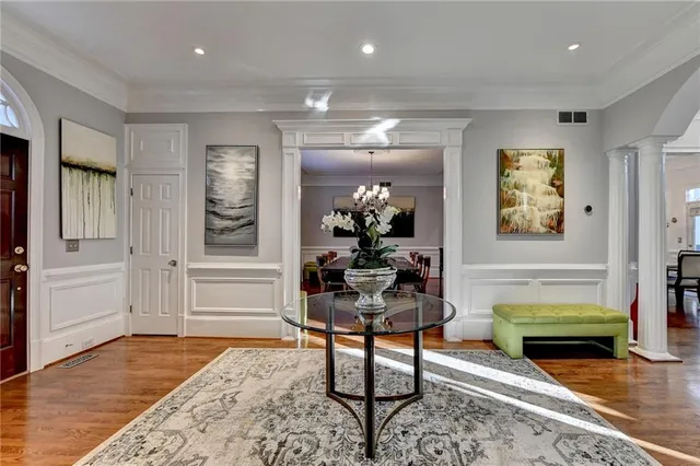 a living room with furniture fireplace and a window
