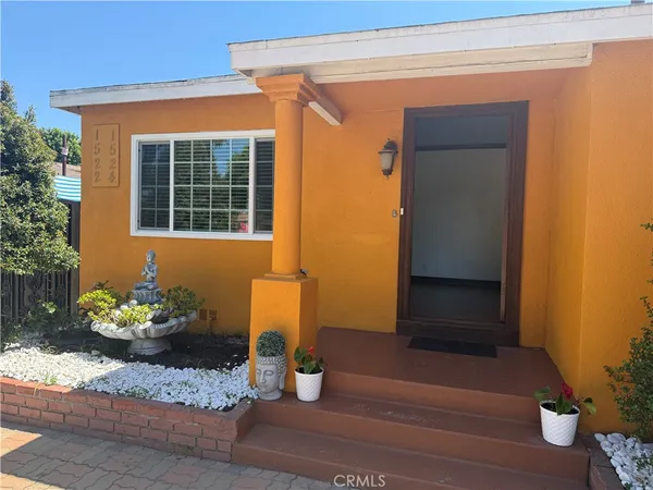a house with a potted plant