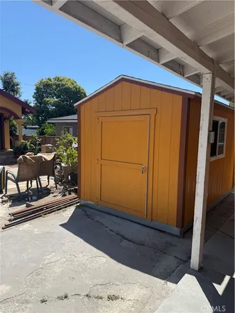a view of backyard with cabin