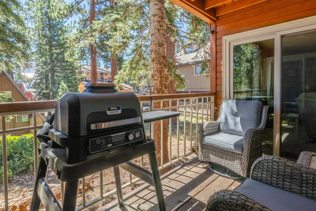 a view of a balcony with chairs