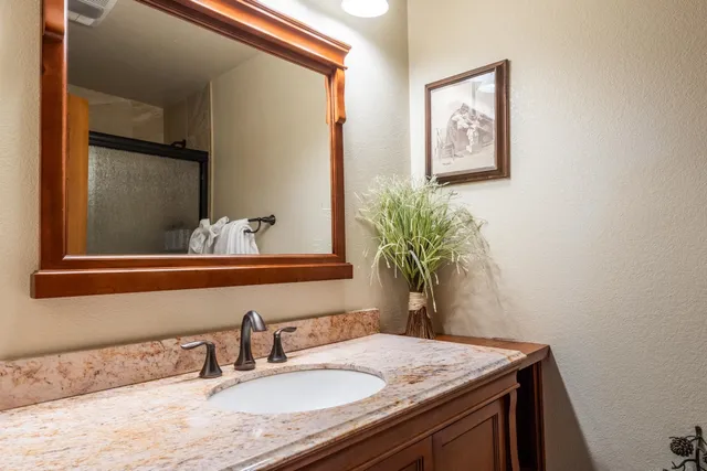 a bathroom with a white tub and shower
