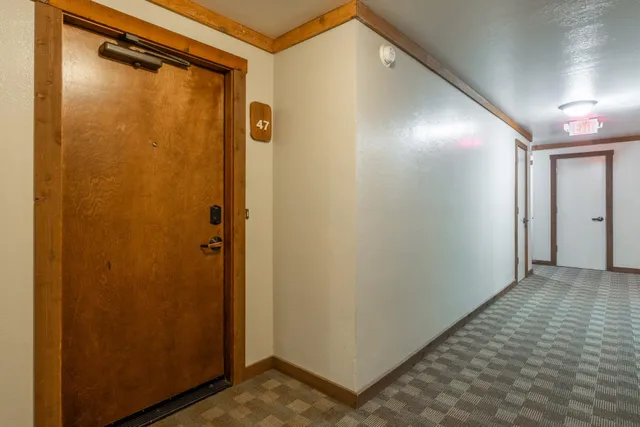a view of a house with a wooden fence